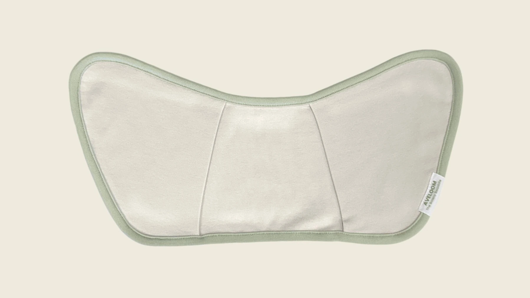AVELOOM The Bolero Swaddle laid flat, showing its upper-body bolero shape